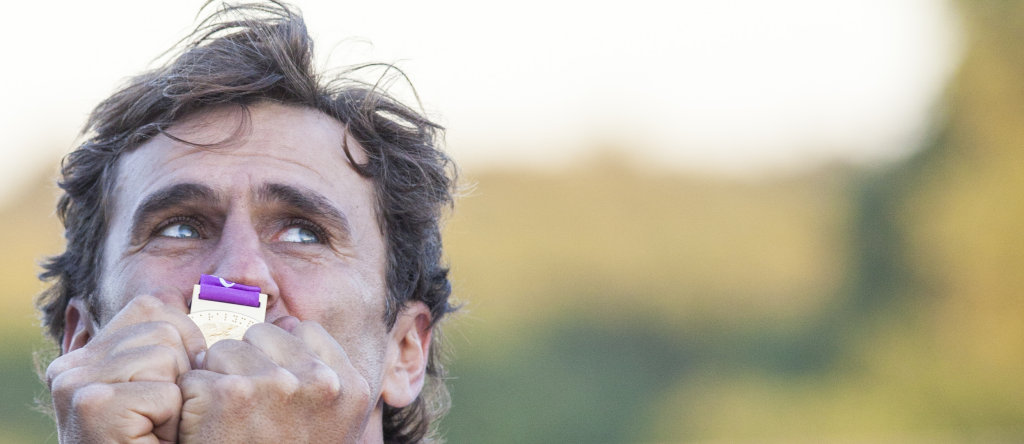 Alex Zanardi react at the medal ceremony  after he wins the race